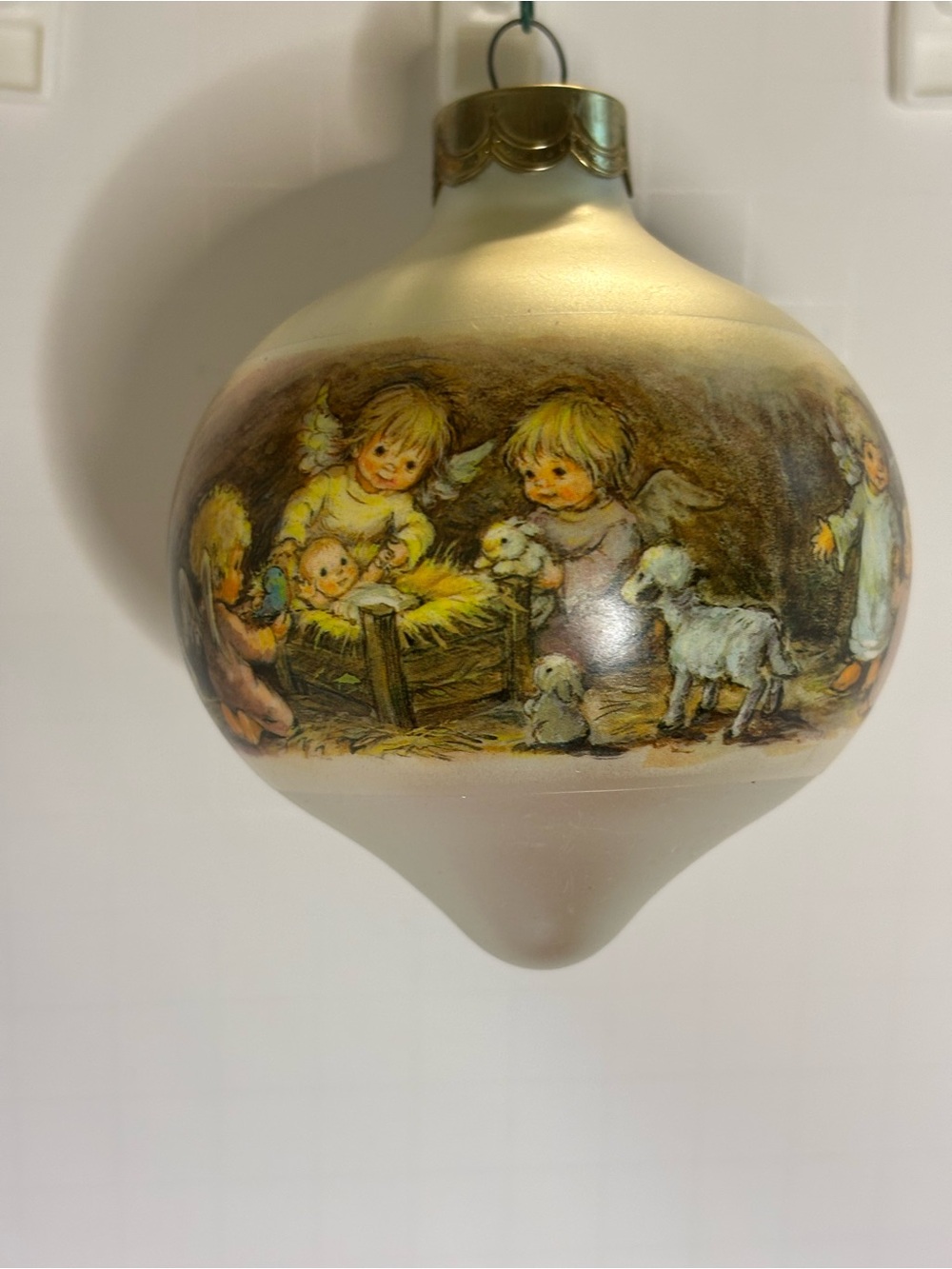 Hallmark 1985 Ivory Christmas Ornament with Angel Nativity Scene